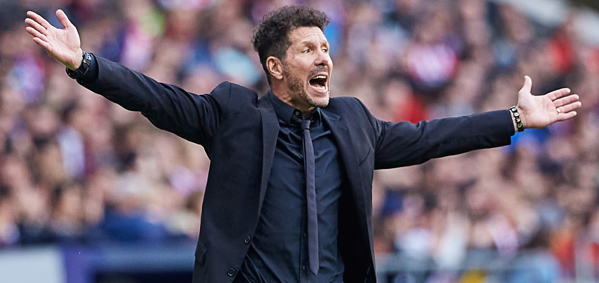 Atlético Madrid trainer Diego Simeone is gesturing during an UEFA Champions League game